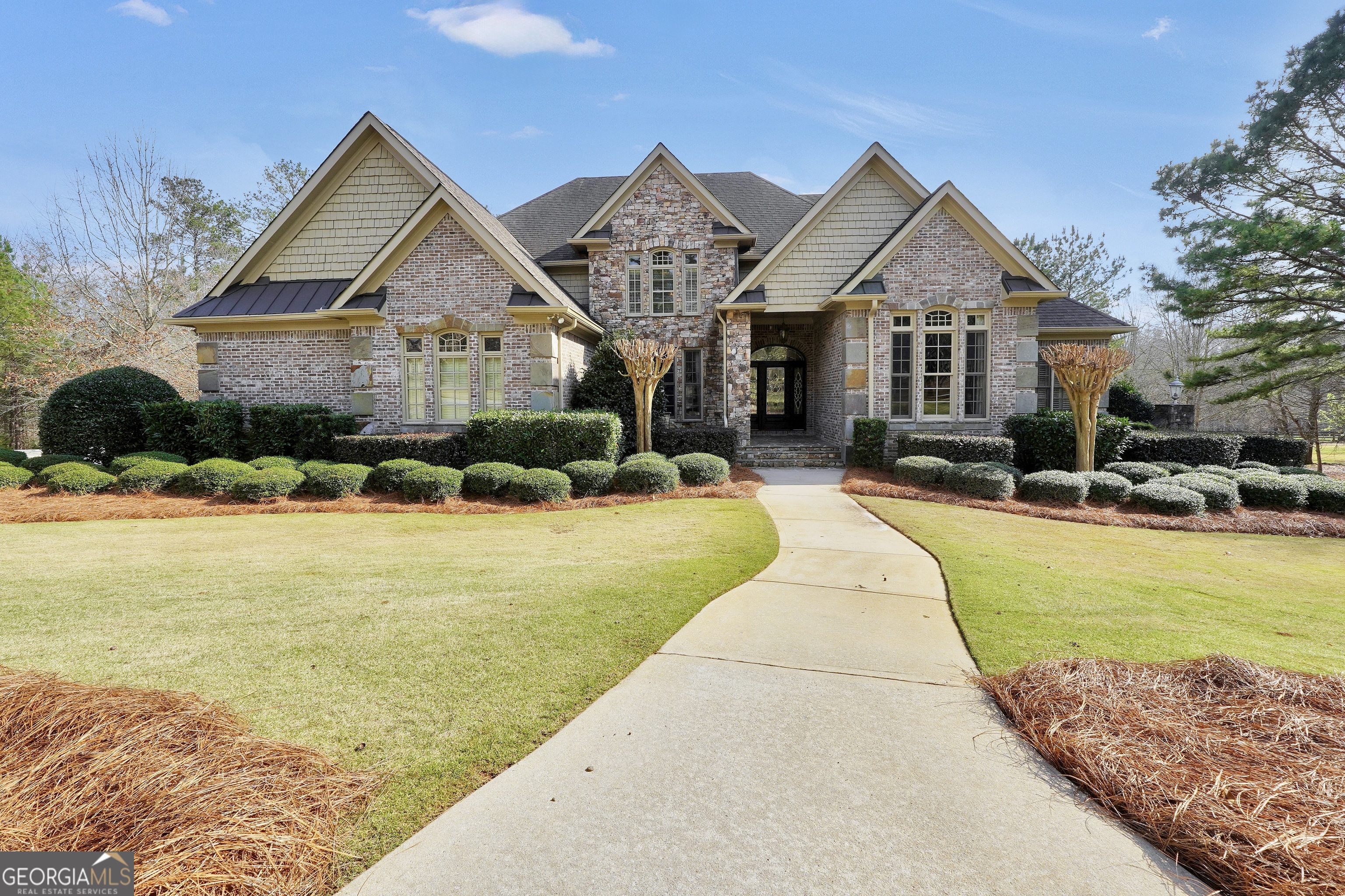 610 Elliott Road McDonough, GA 30252 - Photo 4 of 92 a front view of a house with swimming pool having outdoor seating