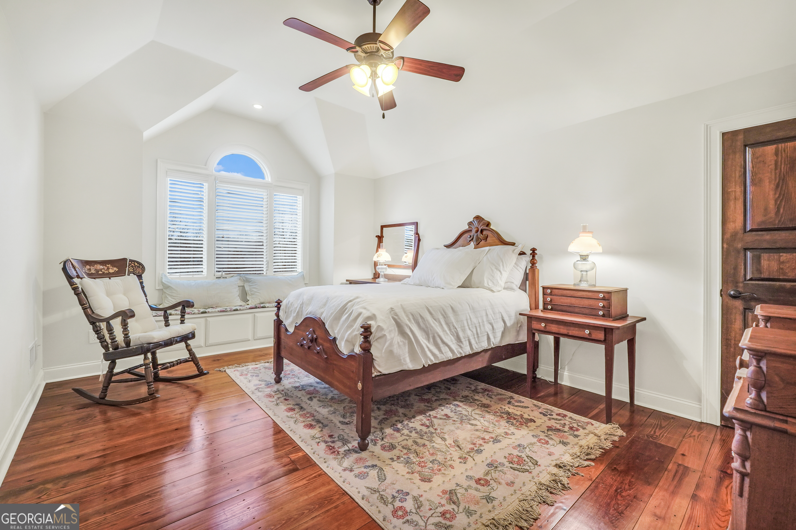 610 Elliott Road McDonough, GA 30252 - Photo 41 of 92 a bedroom with a bed a chair and a chandelier