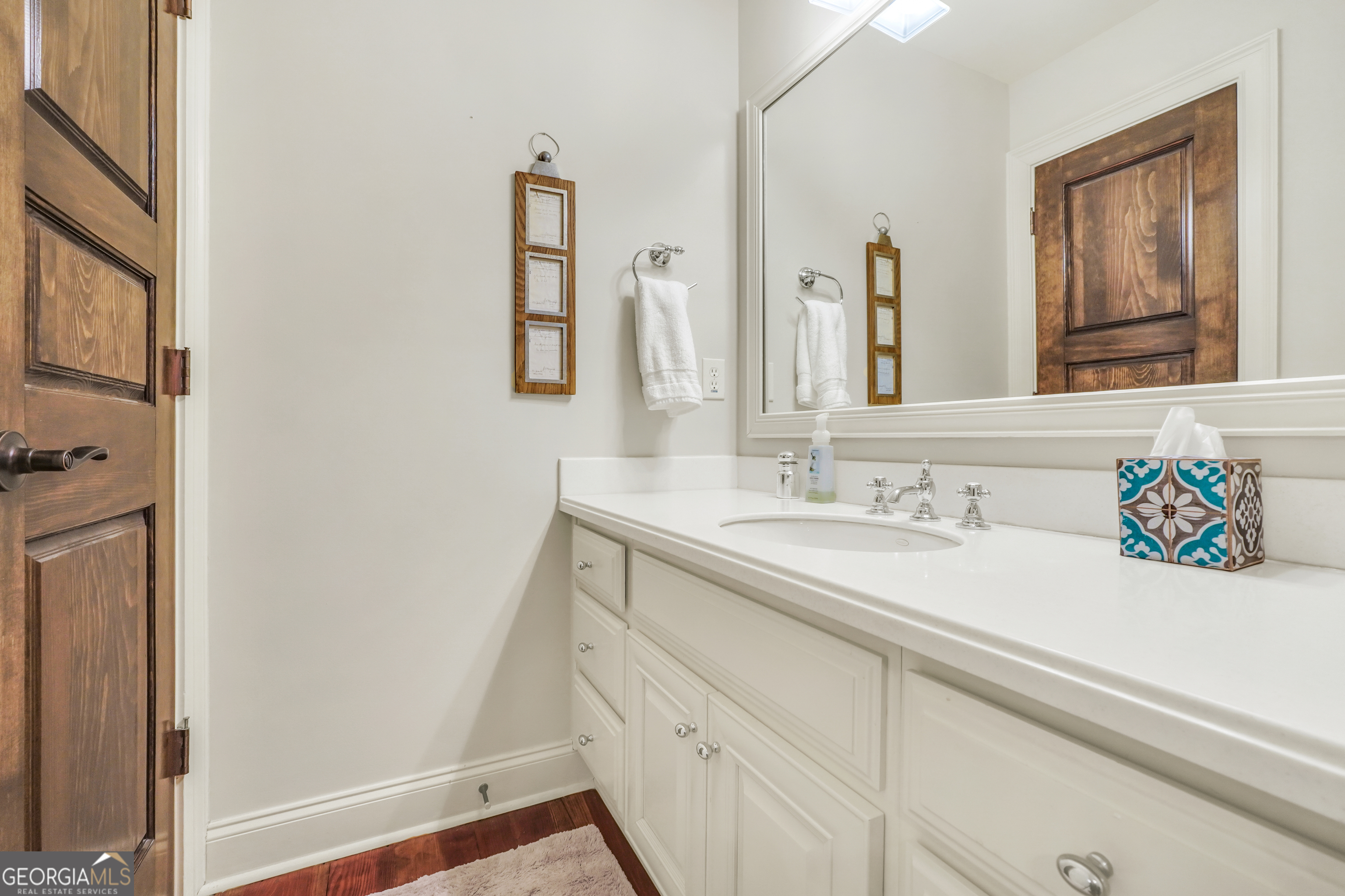 610 Elliott Road McDonough, GA 30252 - Photo 50 of 92 a bathroom with a sink and a mirror