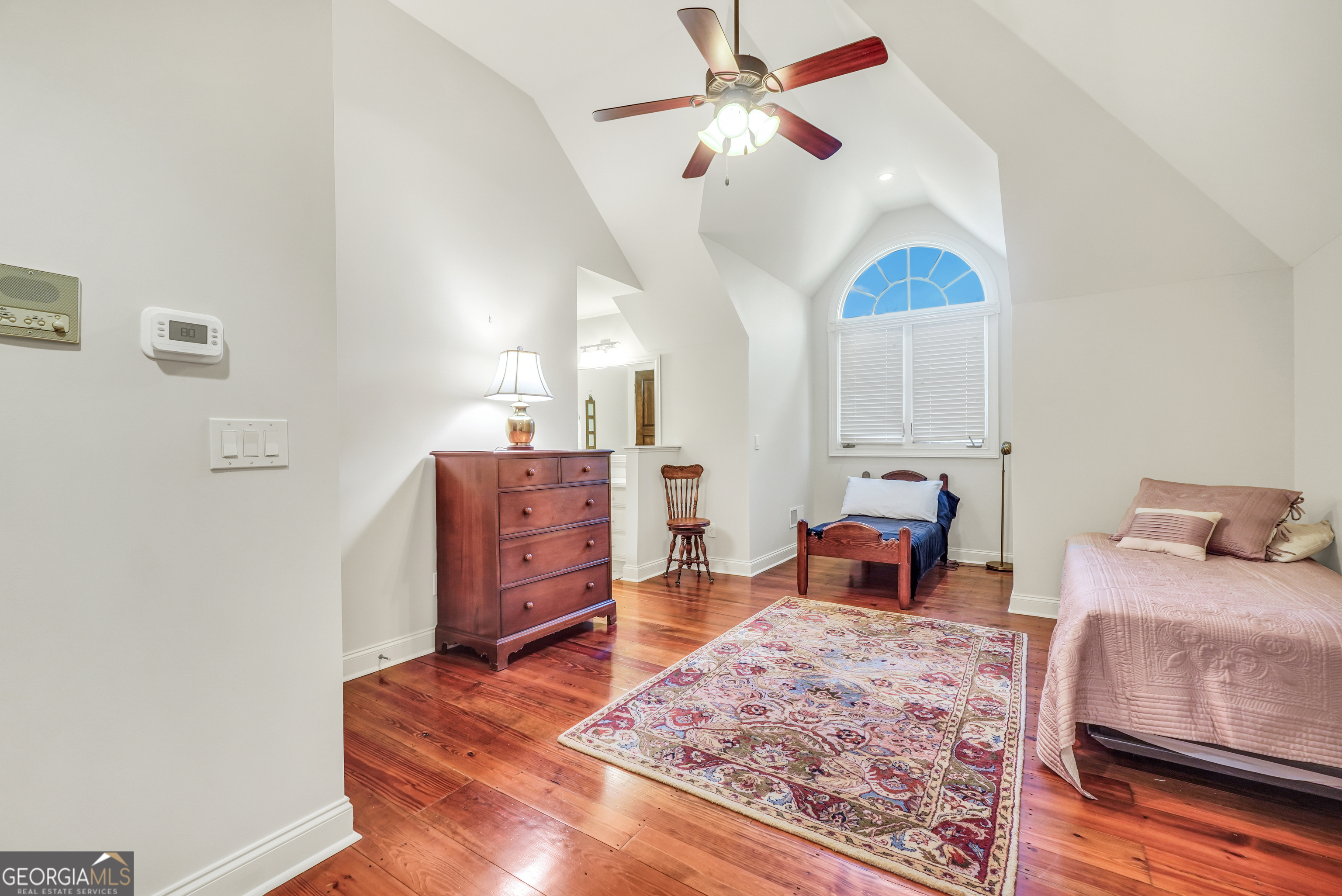 610 Elliott Road McDonough, GA 30252 - Photo 53 of 92 a bedroom with a bed and wooden floor