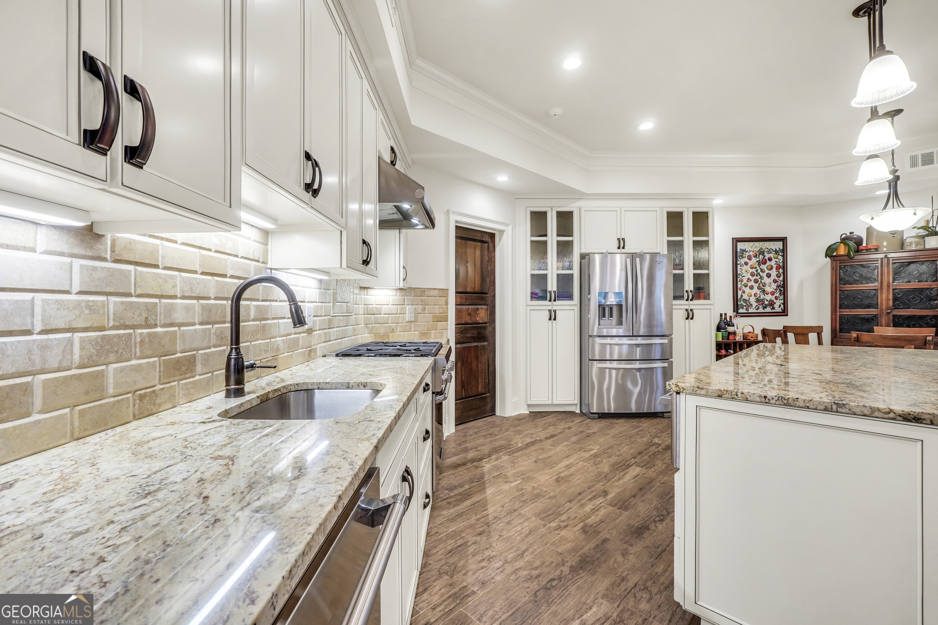 610 Elliott Road McDonough, GA 30252 - Photo 56 of 92 a kitchen with stainless steel appliances granite countertop a sink and a refrigerator