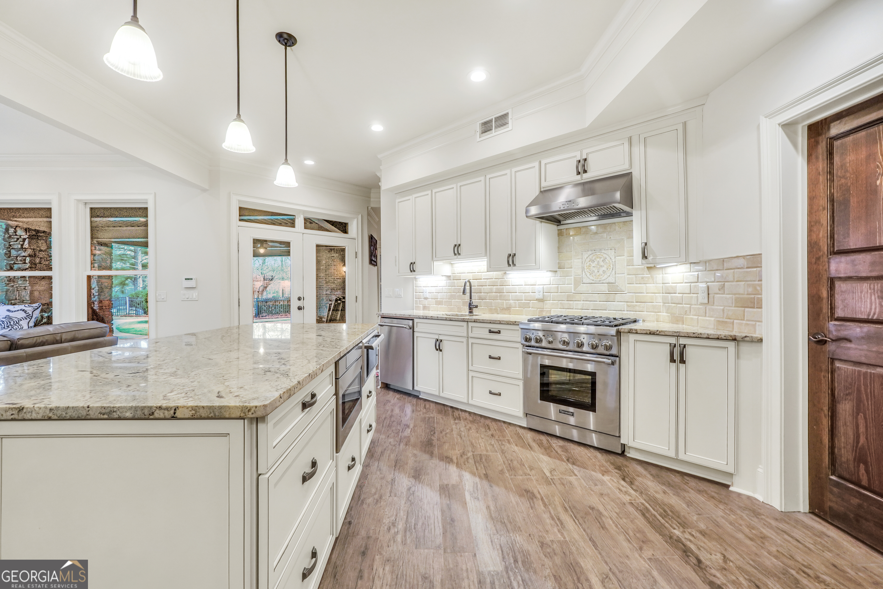 610 Elliott Road McDonough, GA 30252 - Photo 57 of 92 a kitchen with stainless steel appliances granite countertop a sink stove and refrigerator