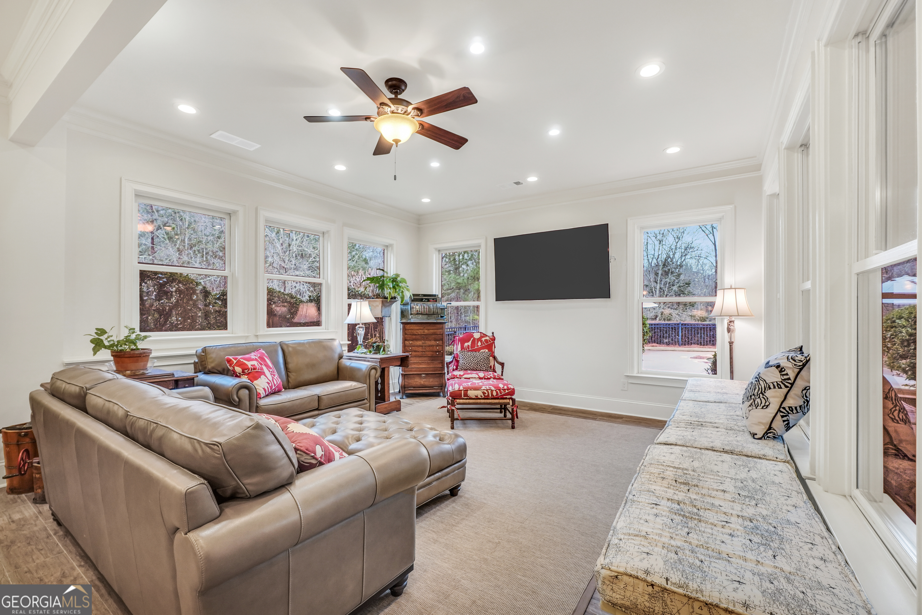 610 Elliott Road McDonough, GA 30252 - Photo 63 of 92 a living room with furniture and a flat screen tv