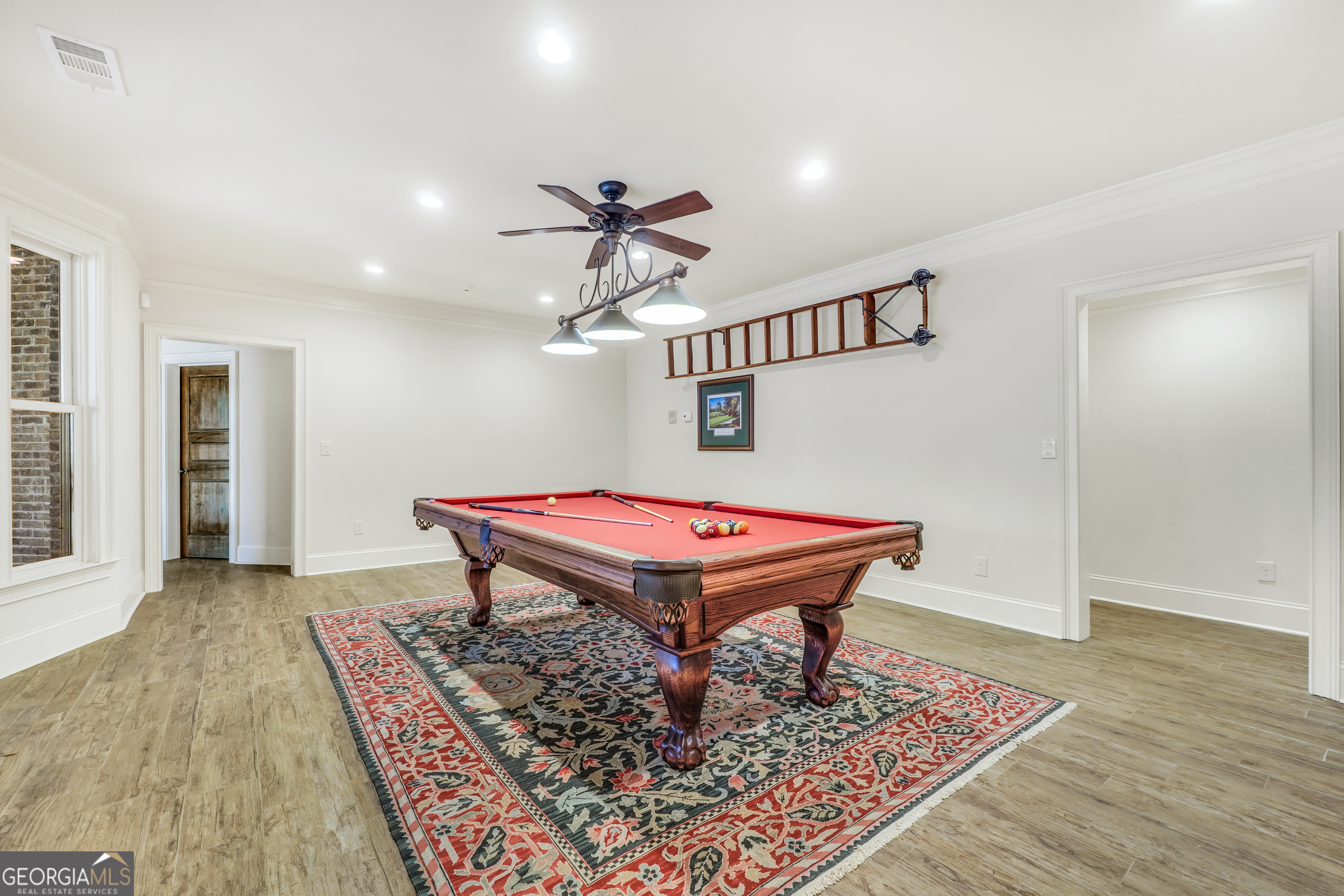 610 Elliott Road McDonough, GA 30252 - Photo 65 of 92 a room with pool table and wooden floor