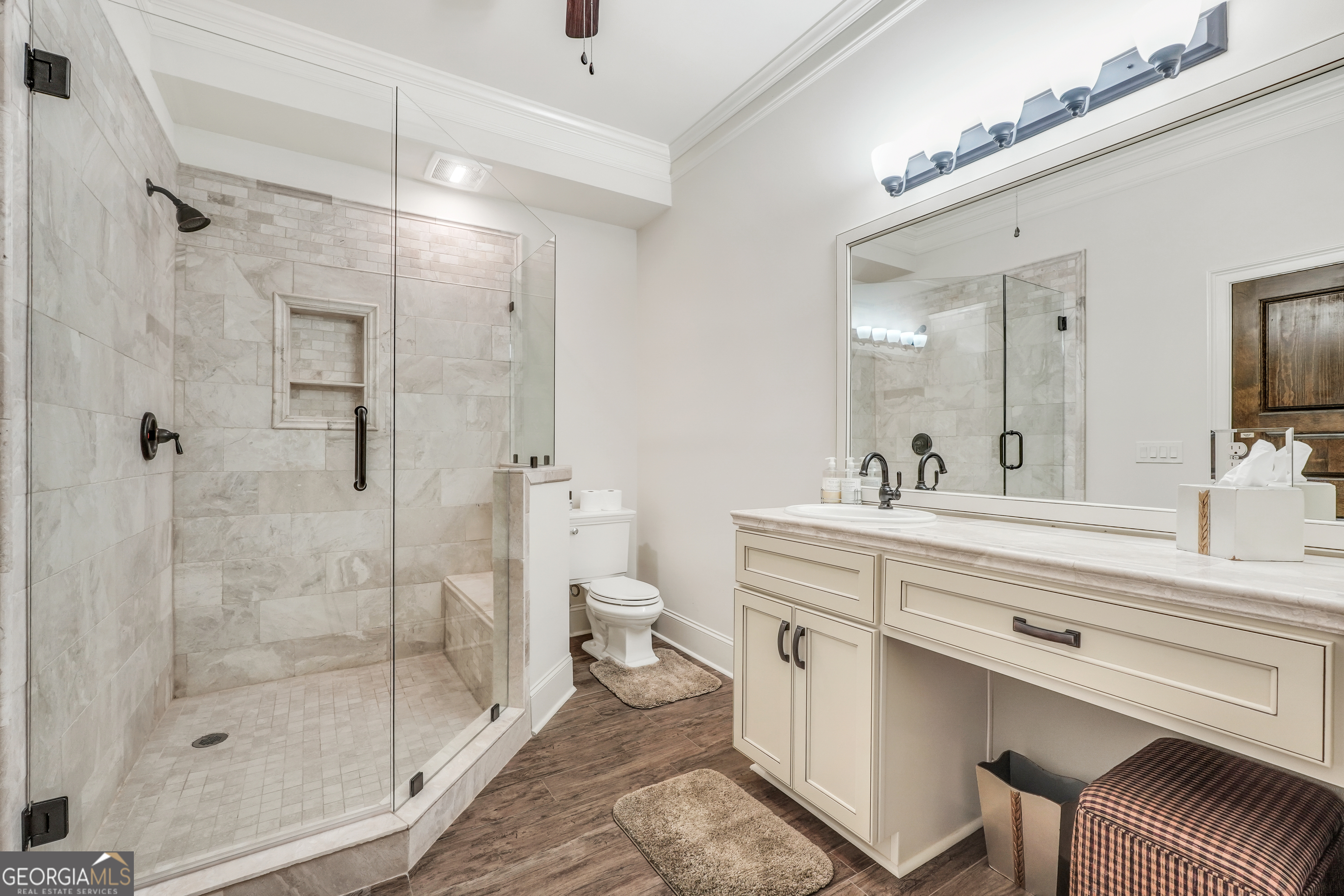 610 Elliott Road McDonough, GA 30252 - Photo 72 of 92 a spacious bathroom with a shower sink mirror and toilet