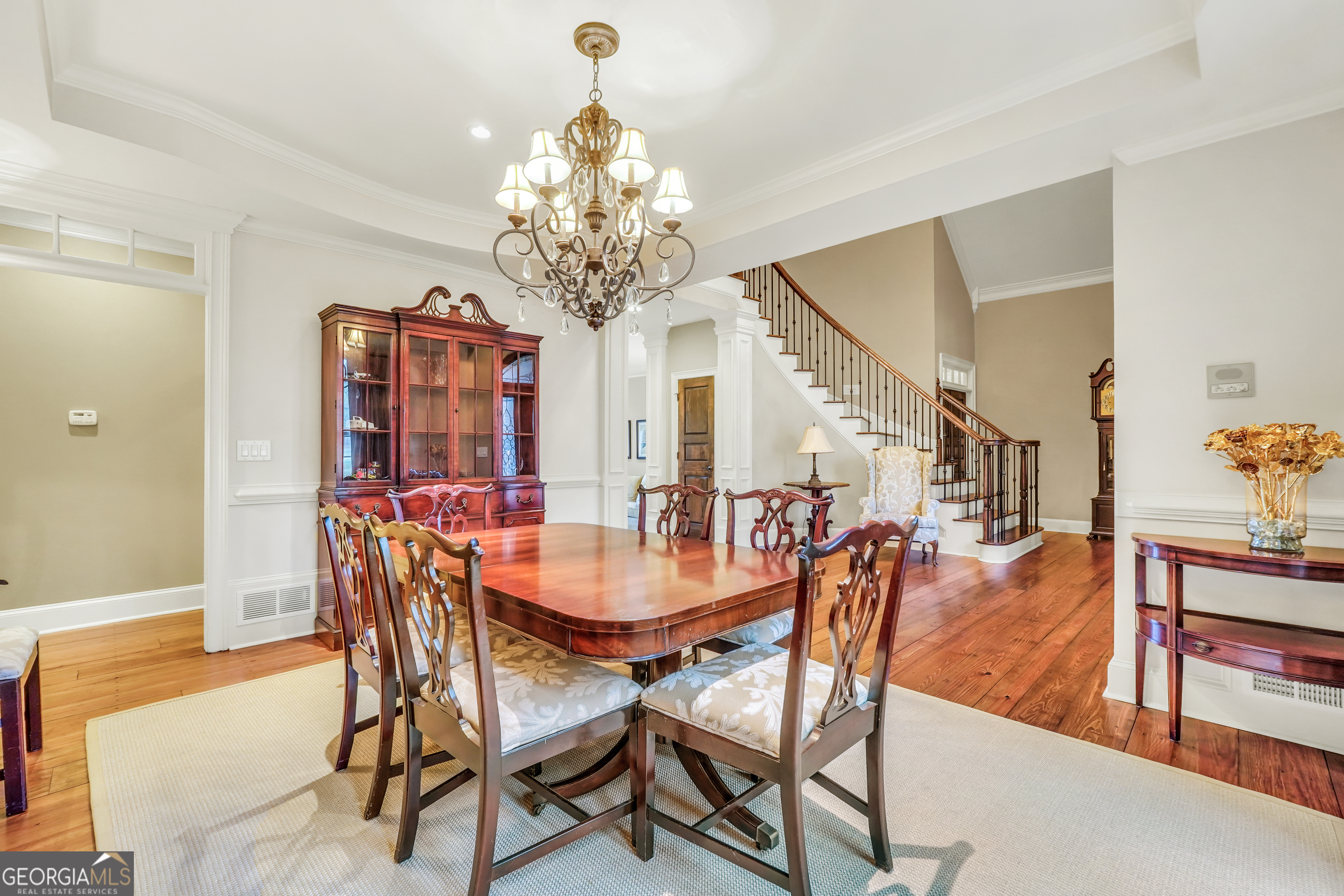610 Elliott Road McDonough, GA 30252 - Photo 10 of 92 a view of a dining room with furniture and chandelier