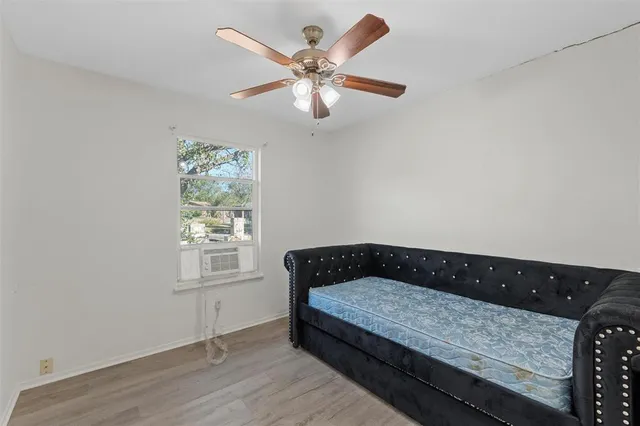 a bedroom with bed and window