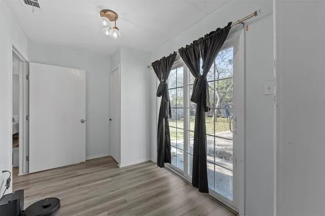 a view of entryway with wooden floor