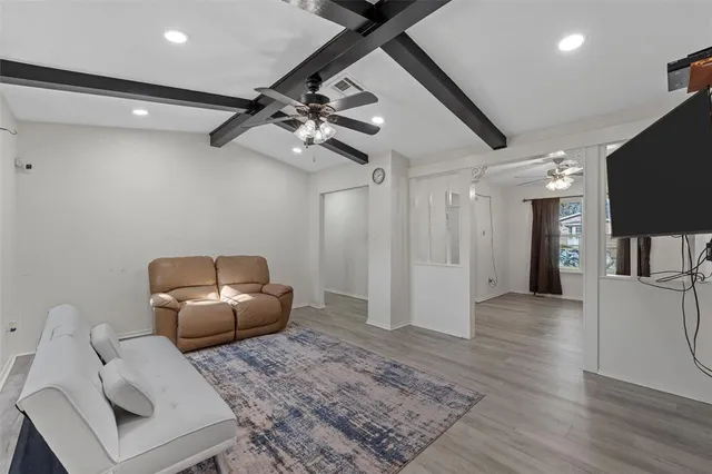 a living room with furniture and a rug