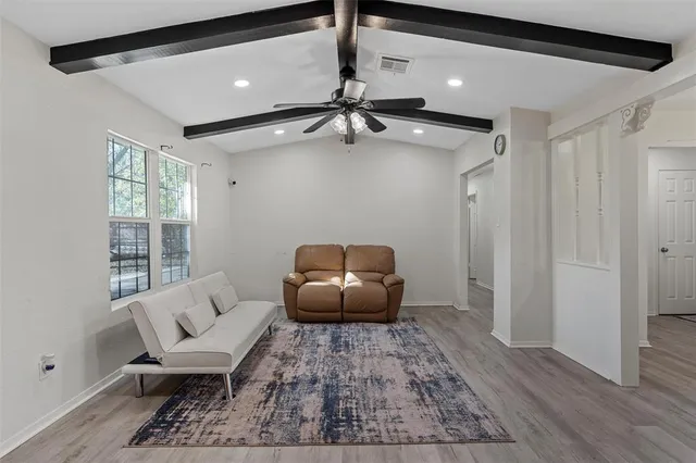 a living room with furniture and a rug
