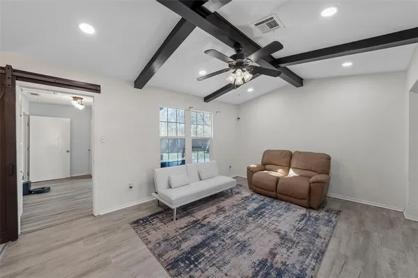 a living room with furniture and a window