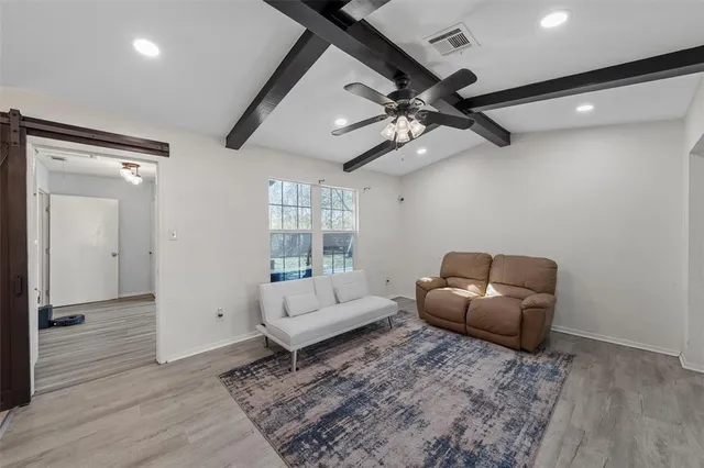 a living room with furniture and a window