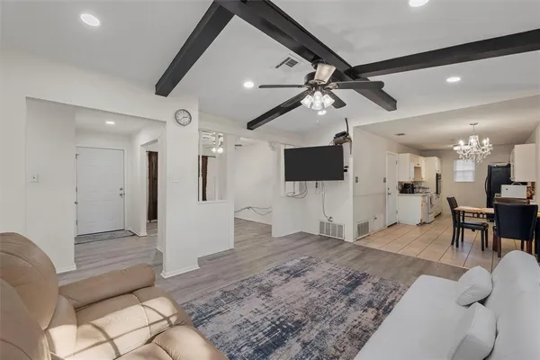 a view of a livingroom with furniture and a flat screen tv
