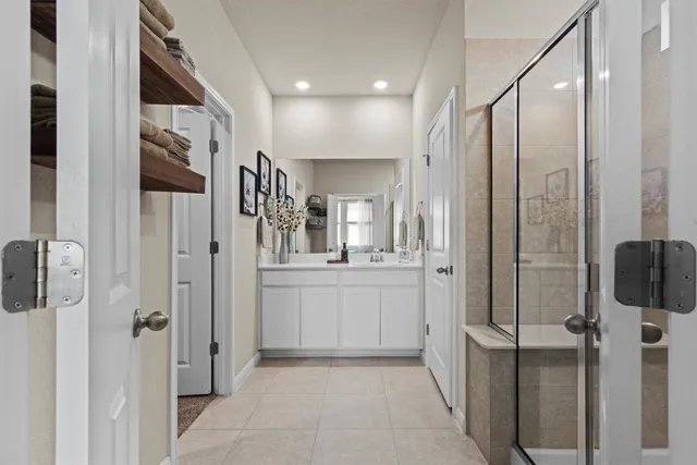 a bedroom with a bed and a flat screen television