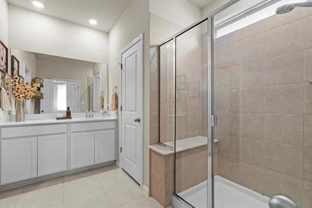 a bathroom with a shower and a sink