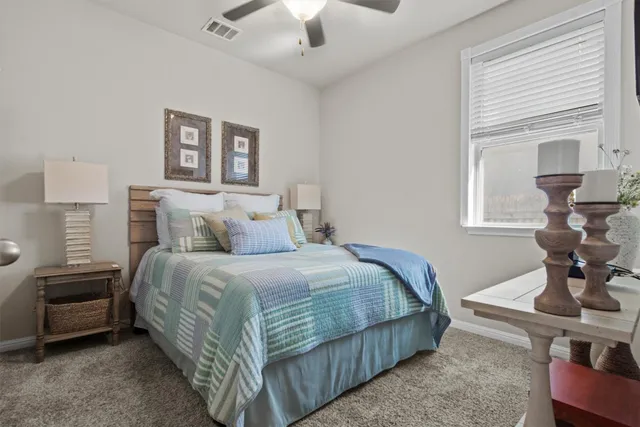 a view of walk in closet with clothes