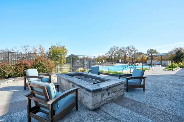a view of a terrace with furniture and a yard