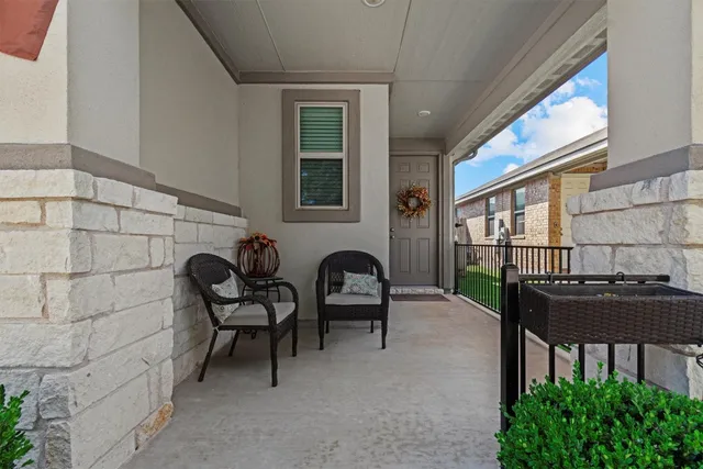 a couple of chairs sitting in front of a door