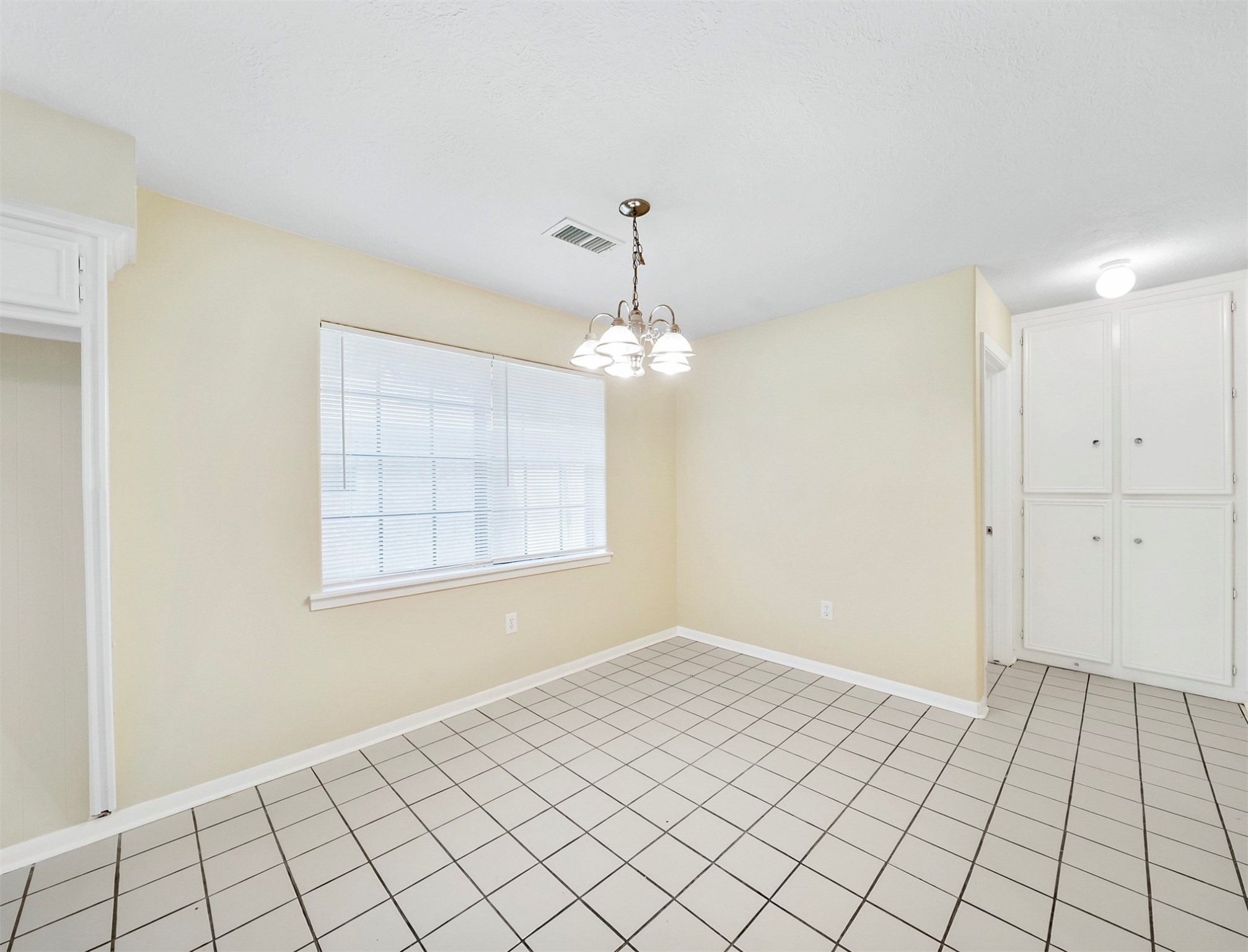 3806 Montego Drive Baytown, TX 77521 - Photo 12 of 19 wooden floor in an empty room with a window