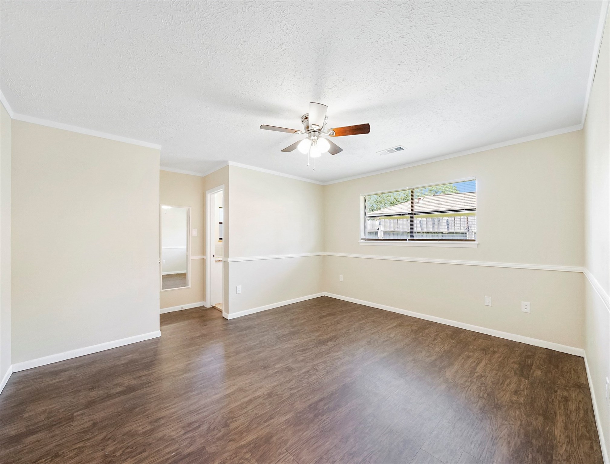 3806 Montego Drive Baytown, TX 77521 - Photo 16 of 19 wooden floor in an empty room with a window