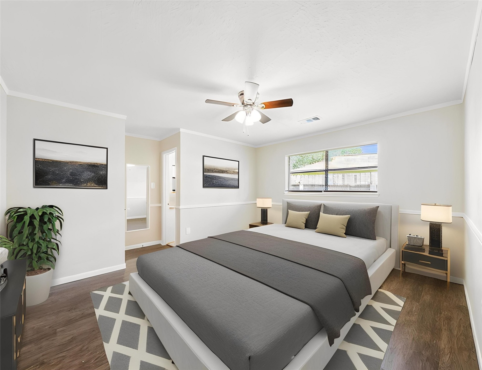 3806 Montego Drive Baytown, TX 77521 - Photo 3 of 19 a bedroom with a large bed and a chandelier