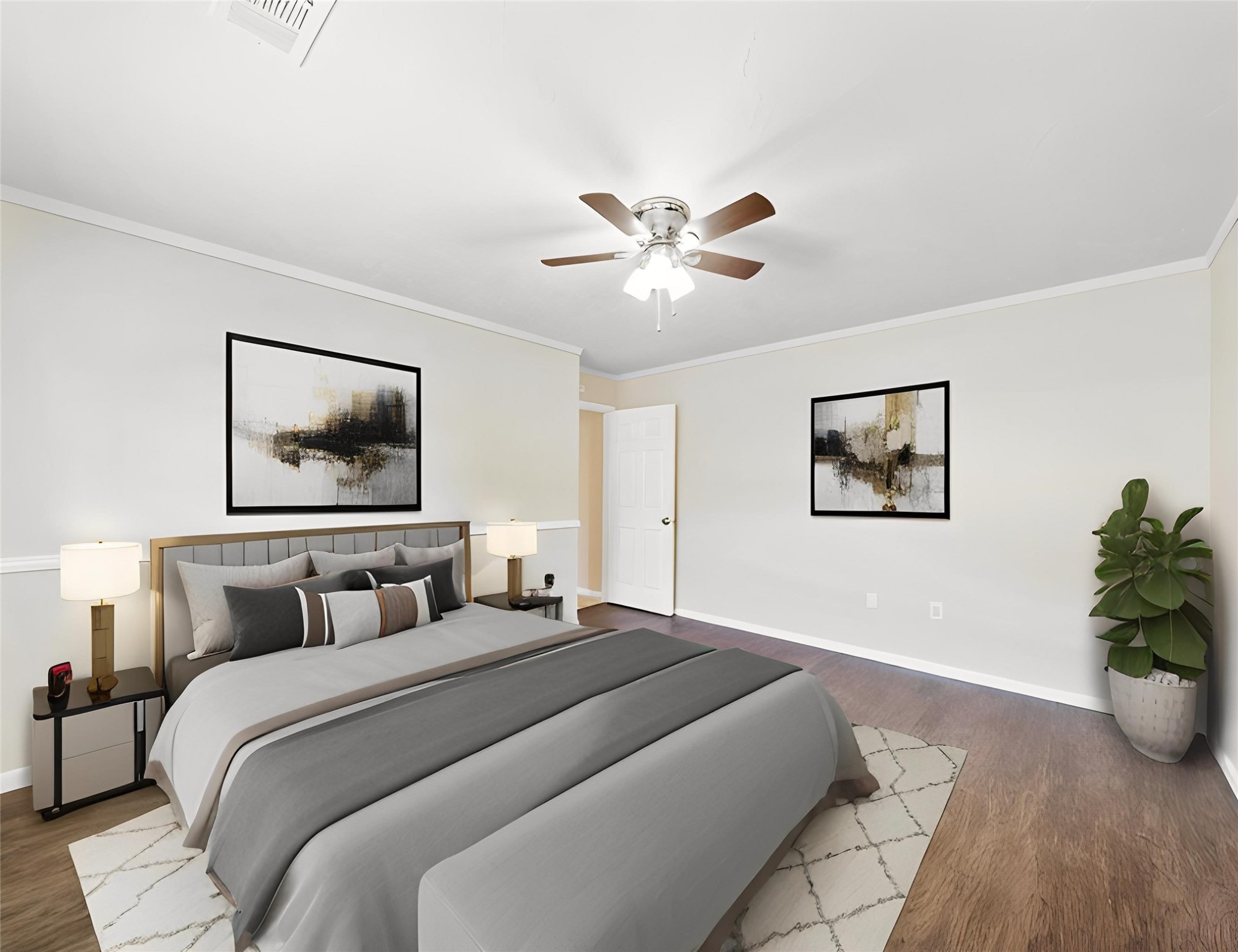 3806 Montego Drive Baytown, TX 77521 - Photo 7 of 19 a bedroom with a large bed and a chandelier