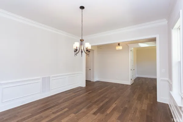 a kitchen with stainless steel appliances granite countertop wooden floors sink and cabinets