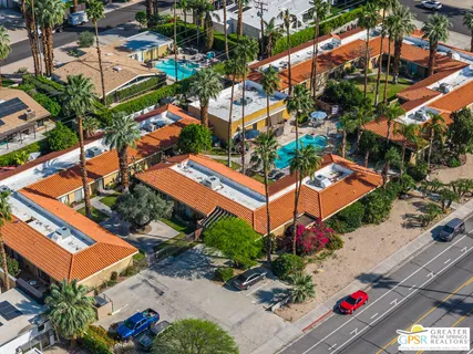 an aerial view of a house with an outdoor space