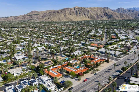 an aerial view of residential houses and outdoor space