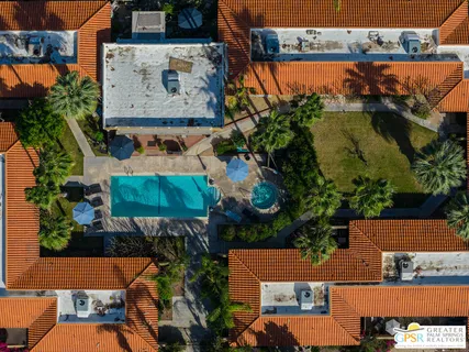 an aerial view of a houses with street