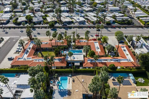 an aerial view of a houses with yard