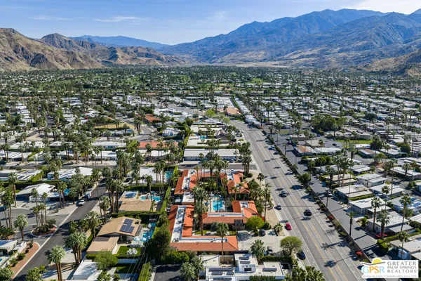 an aerial view of residential house and sandy dunes