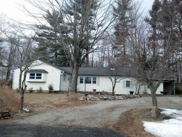 121 Bayberry Hill Road Ridgefield, CT 06877 - Photo 1 of 1 a white house that has a tree in front of it
