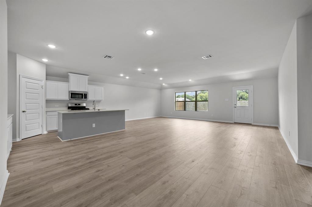 533 Hickory Rdg Drive Van Alstyne, TX 75495 - Photo 15 of 31 a view of kitchen with a sink and dishwasher a refrigerator with wooden floor