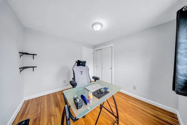a bedroom with a bed and a table