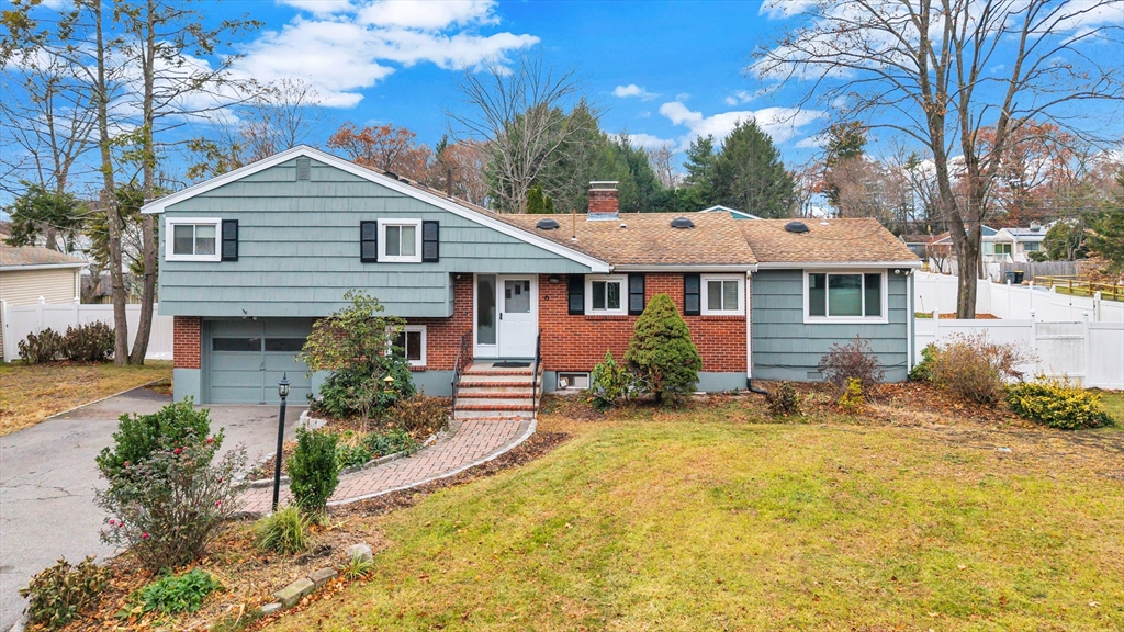 6 Woodward Road Framingham, MA 01701 - Photo 2 of 41 a front view of a house with a yard