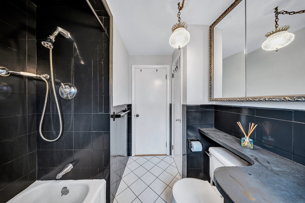 6 Woodward Road Framingham, MA 01701 - Photo 22 of 41 a bathroom with a sink a toilet and shower