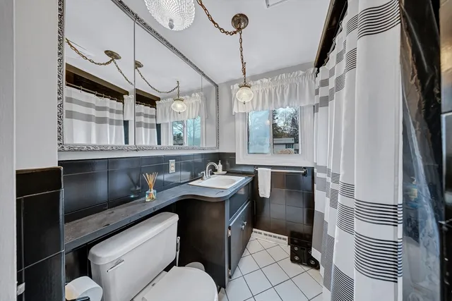a kitchen with a sink appliances and cabinets