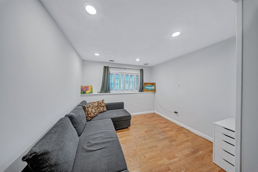 6 Woodward Road Framingham, MA 01701 - Photo 25 of 41 a living room with furniture and a couch