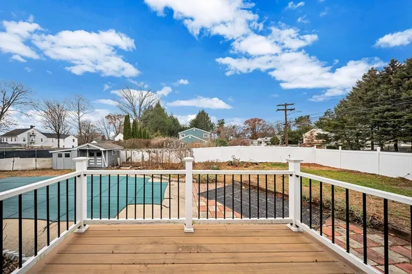a view of a balcony with wooden fence