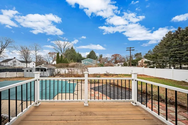 a view of a balcony with wooden fence