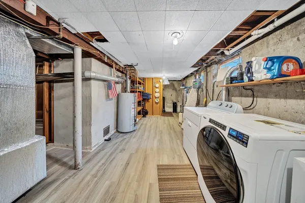 a view of a storage & utility room with stairs