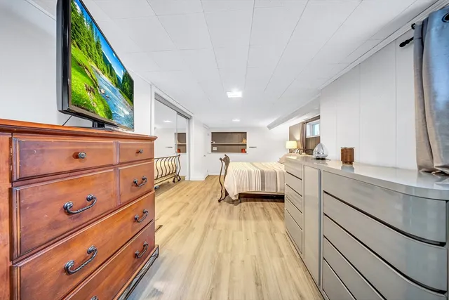 a kitchen with a sink and wooden floor