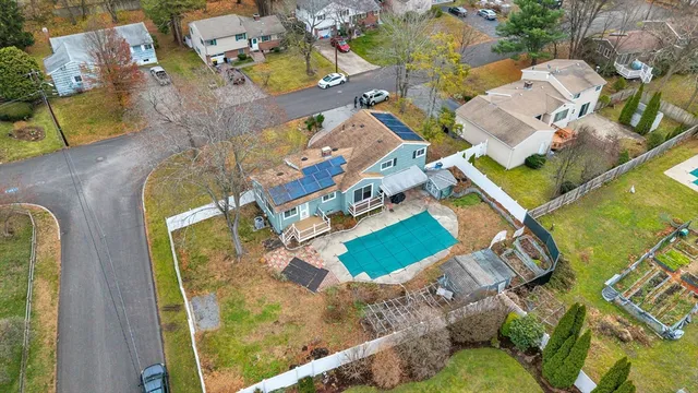 an aerial view of residential houses with outdoor space