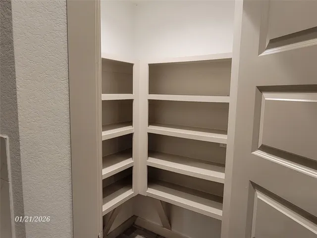 a stove top oven sitting inside of a kitchen