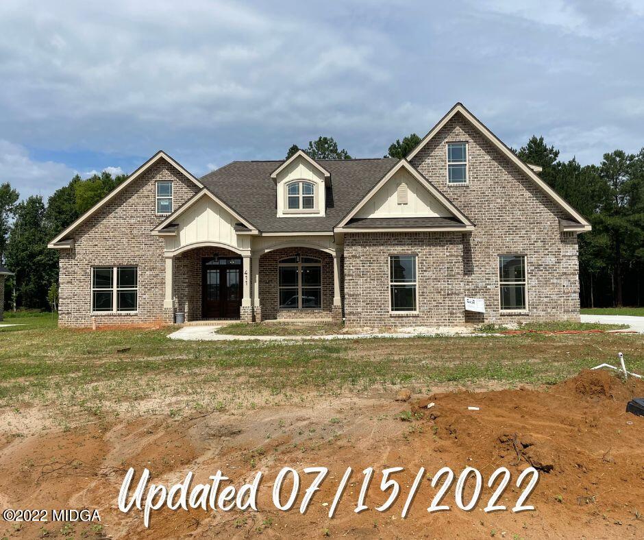 411 Stonegate Trail Perry, GA 31069 - Photo 2 of 14 a front view of a house with a yard