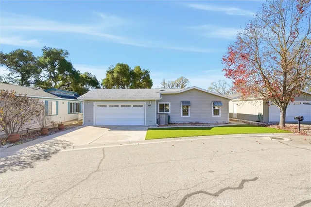 a house with swimming pool in front of it