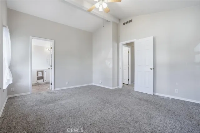 a bathroom with a toilet a sink and a mirror