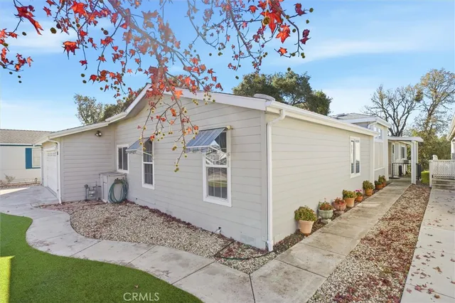 a view of a house with a backyard