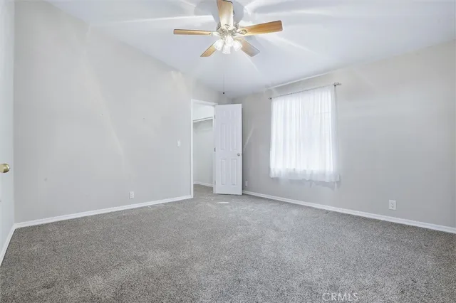 a view of a chair and tables in the patio